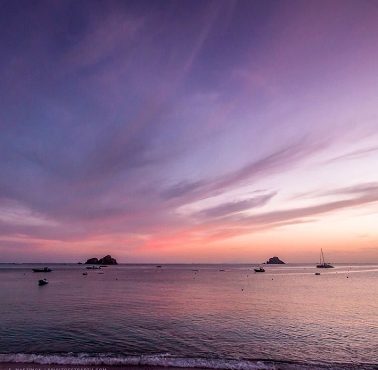 Purple-hued evening clouds above the sea at Corossol beach MellowMood St Barth
